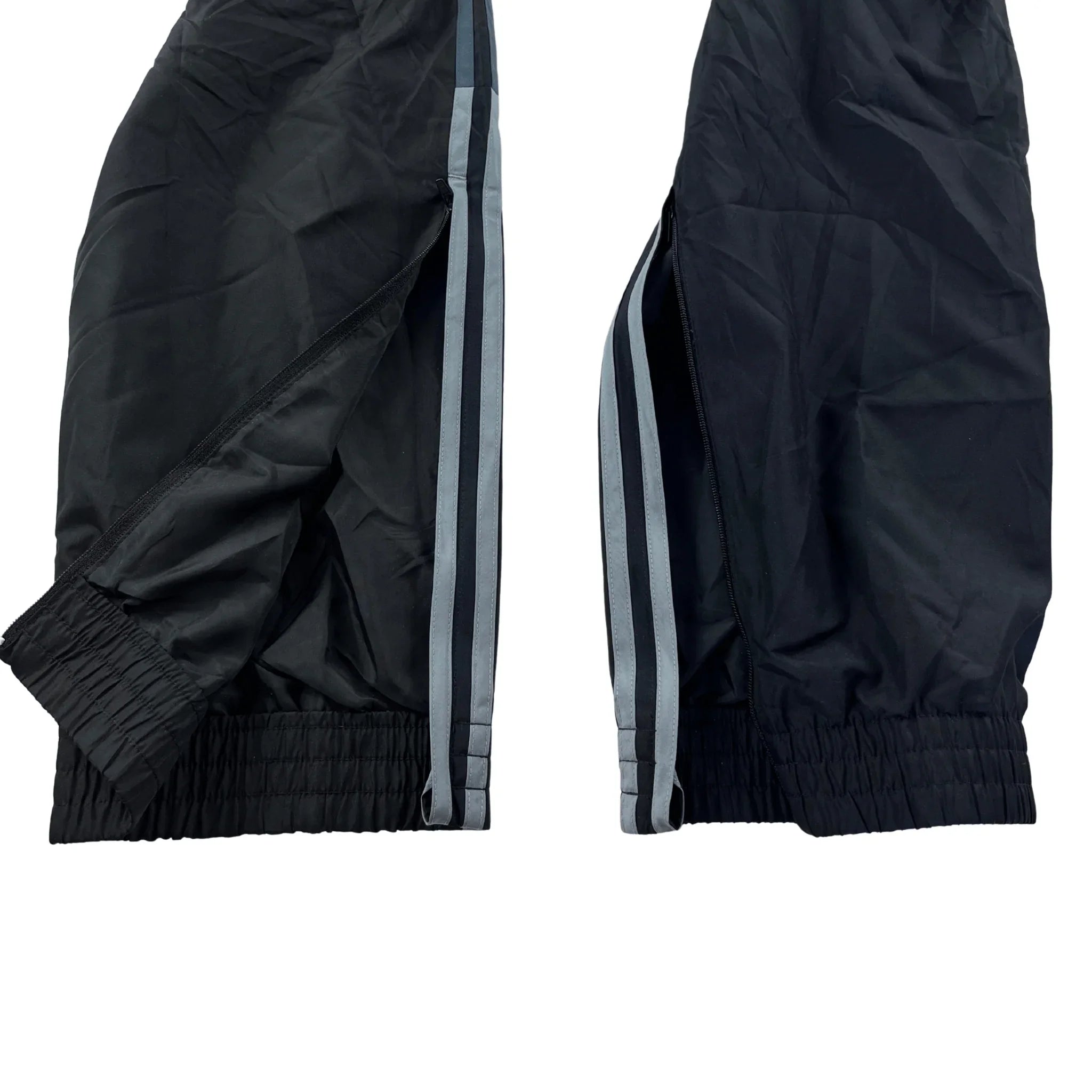 Schwarze Adidas Trackpants Vintage streifen mit elastischen Bündchen und seitlichen weißen Streifen