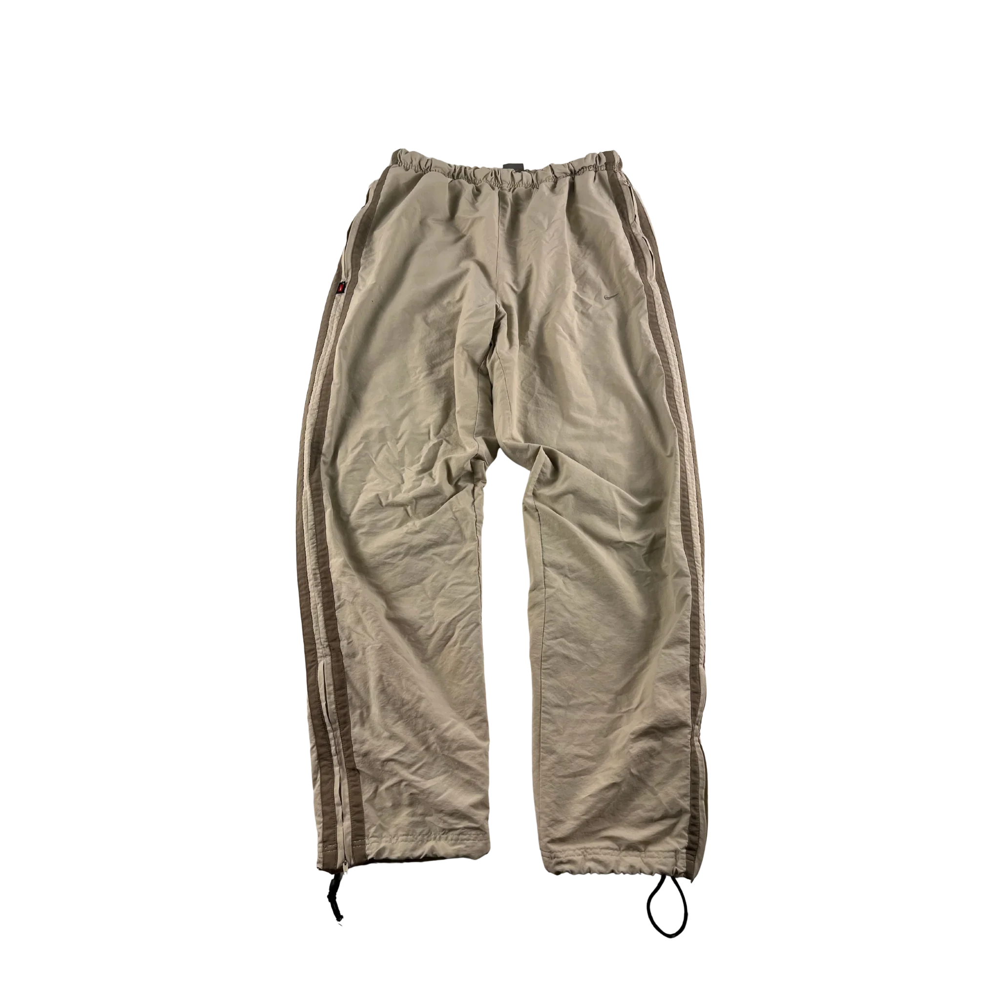 Baggy Nike Trackpants Vintage Sandfarben von Kickvault mit elastischem Bund und seitlichen Streifen