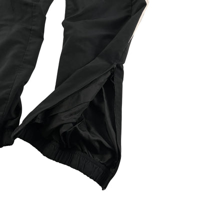 Adidas vintage trackpants classic baggy fit schwarz mit elastischem Bund und Reißverschluss am Beinabschluss