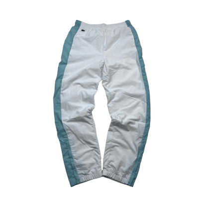 Lacoste Trackpants Vintage weiß mit blauen Seiteneinsätzen und elastischem Bund von Kickvault