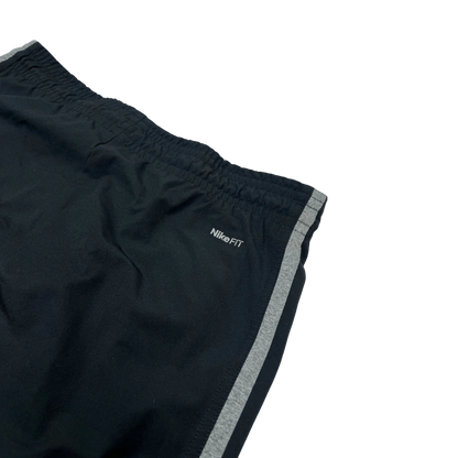 Nike Jogginghose schwarz Damen S von Kickvault mit elastischem Bund und seitlichem grauem Streifen