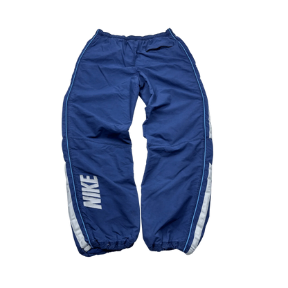 Nike Trackpants Blau Vintage von Kickvault in blau mit weißem NIKE Schriftzug und elastischem Bund