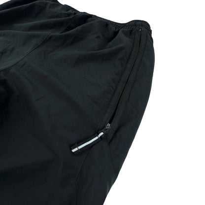 Nike Trackpants Vintage schwarz mit Reißverschlusstasche und elastischem Bund aus leichtem Material