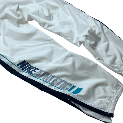 Kickvault Vintage Nike Trackpants weiß mit blauem Schriftzug und elastischem Bund