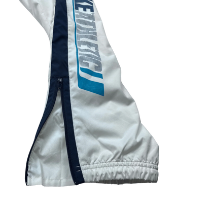 Vintage Nike Trackpants weiß von Kickvault mit seitlichem Reißverschluss und elastischem Bund